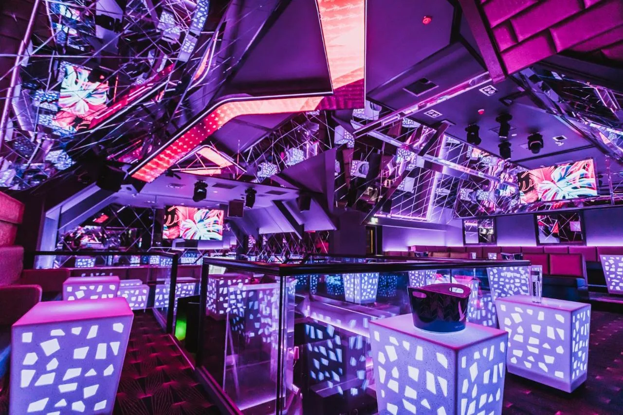 a nightclub with purple and pink lighting at The Vermont Hotel Newcastle in Newcastle upon Tyne